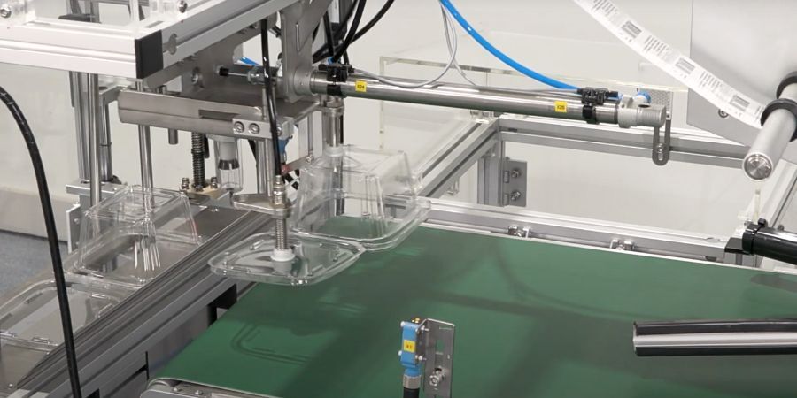 Clam Shell Denester Top Uses for Denesters: From Trays to Clamshell Containers